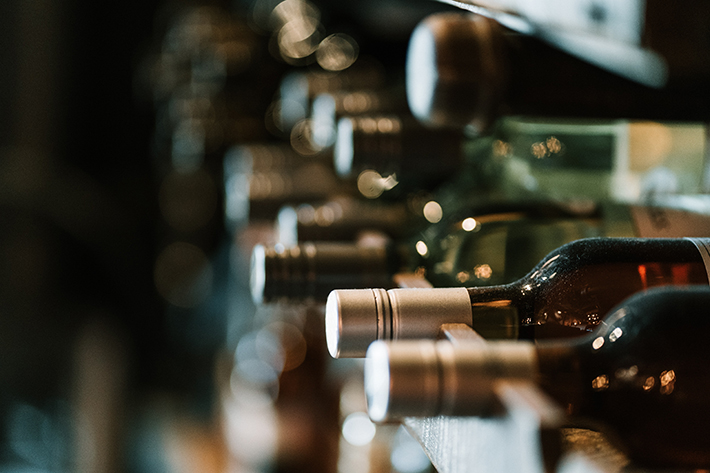 Winebottles on the rack.