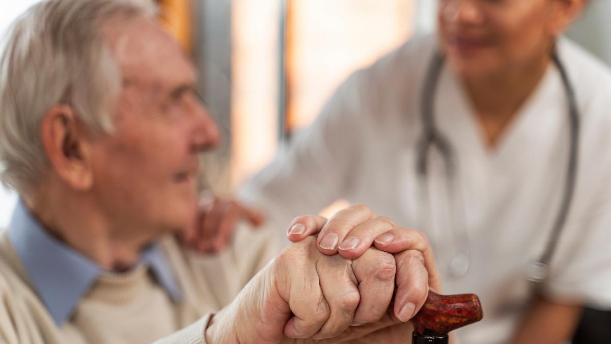 Elderly person with a nurse.